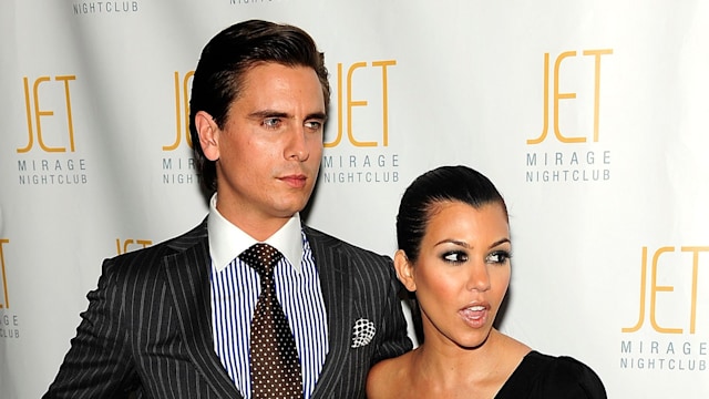 Kourtney Kardashian and Scott Disick dressed in smart clothes