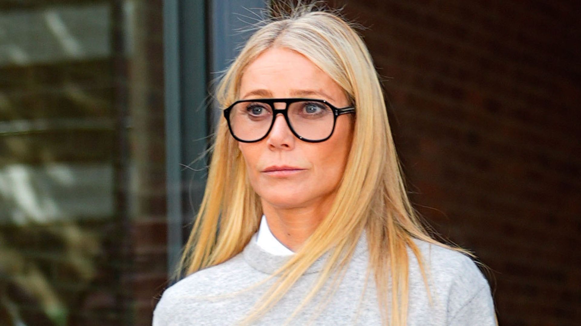 photo of gwyneth paltrow wearing glasses and grey outfit