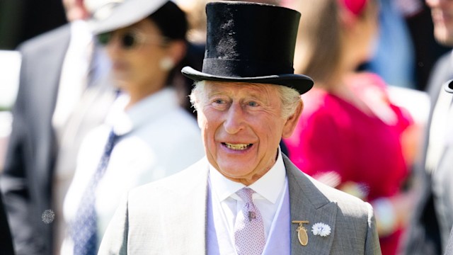 Smiling King Charles in top hat