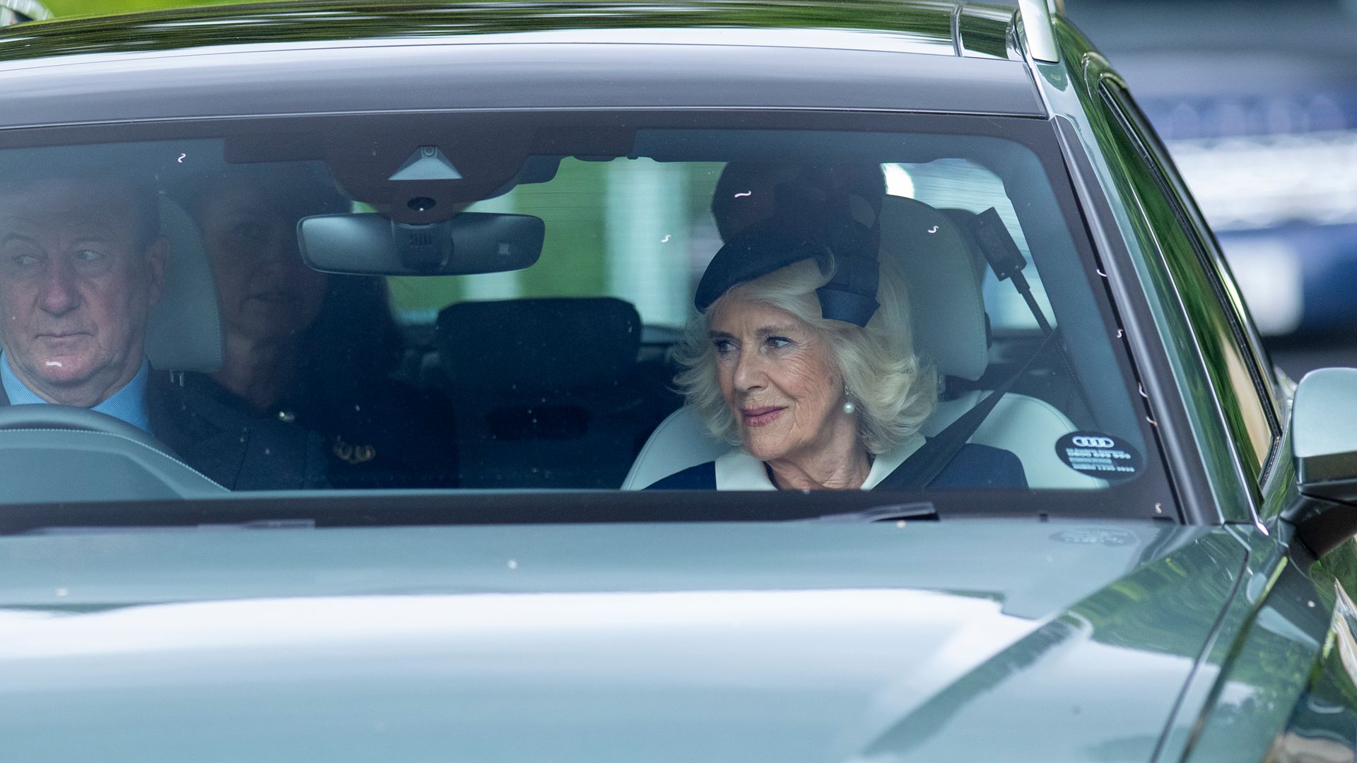 Queen Camilla and a driver in a car