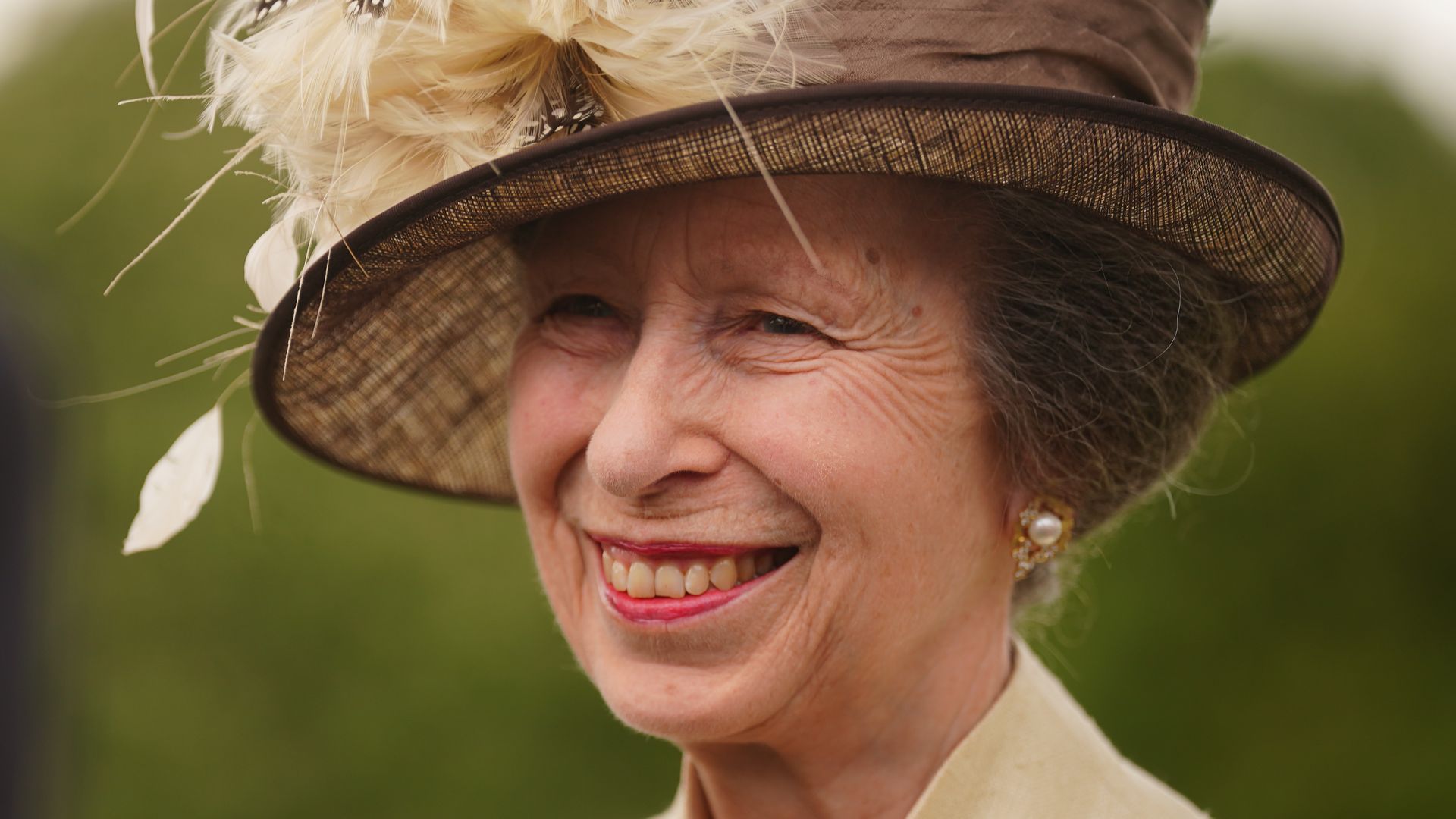 Princess Anne in a feathered hat