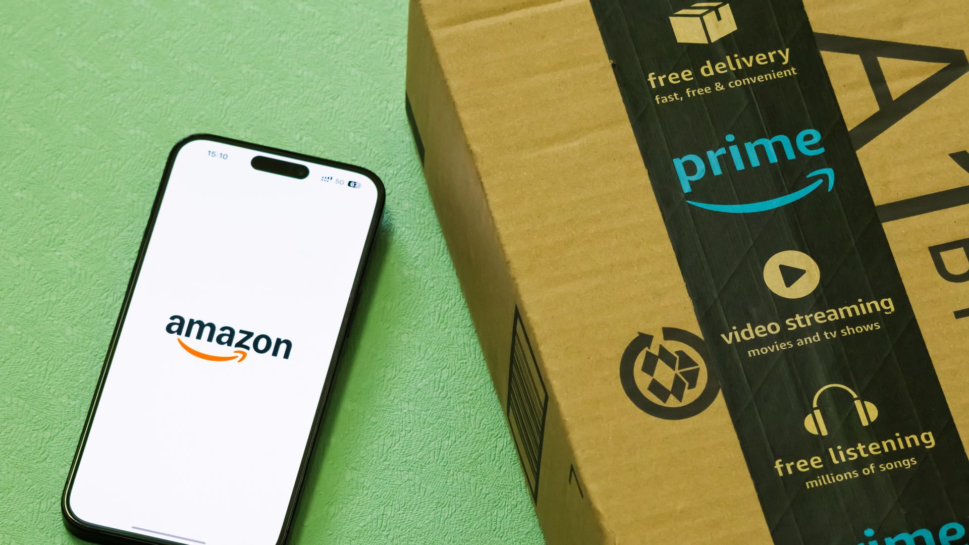 In this photo illustration, a smartphone displaying the logo of Amazon.com Inc. 