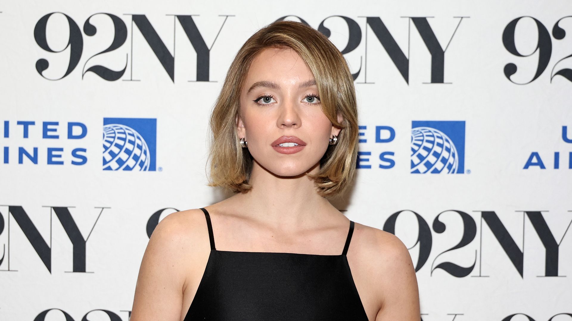 Sydney Sweeney exposes tiny waist and endless legs in partially see-through mini-dress