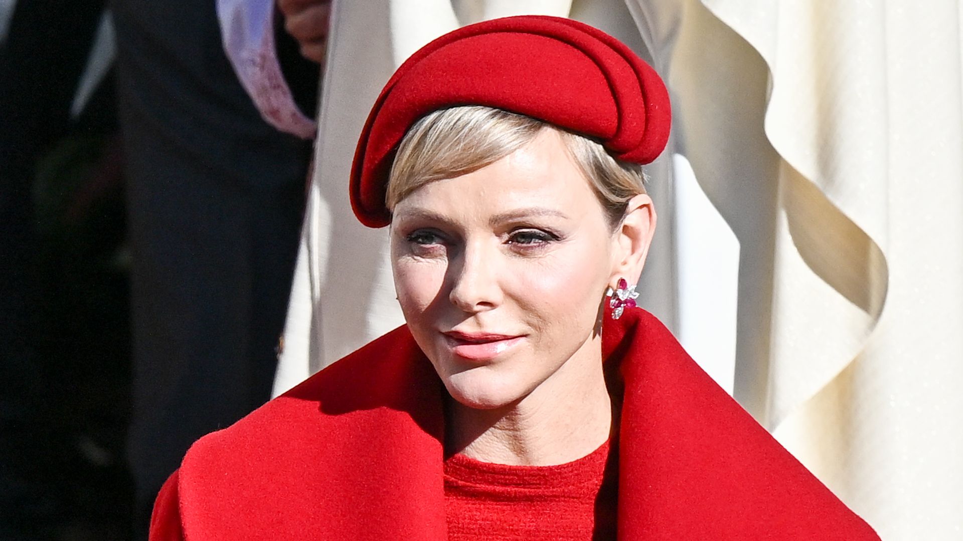 Princess Charlene looks sublime in scarlet alongside twins Prince Jacques and Princess Gabriella