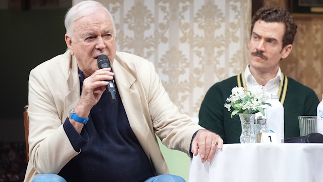 John Cleese and Adam Jackson-Smith as Basil Fawlty during a Q&A session 