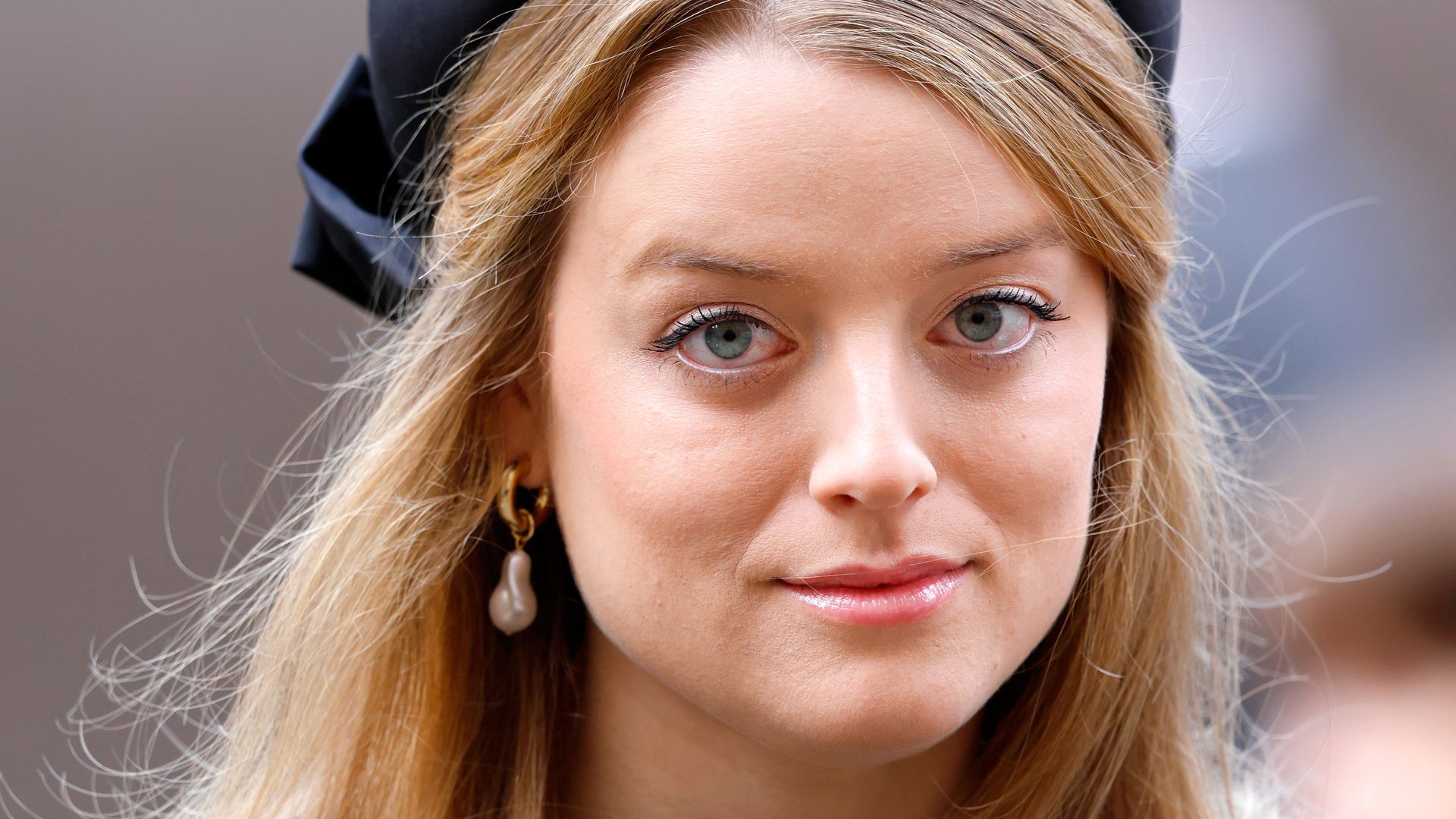 Flora Vesterberg in a black hat with her hair down