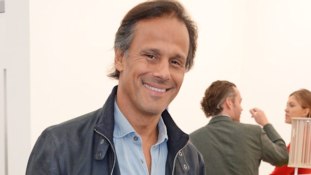 Arun Nayar smiling in a close up photo