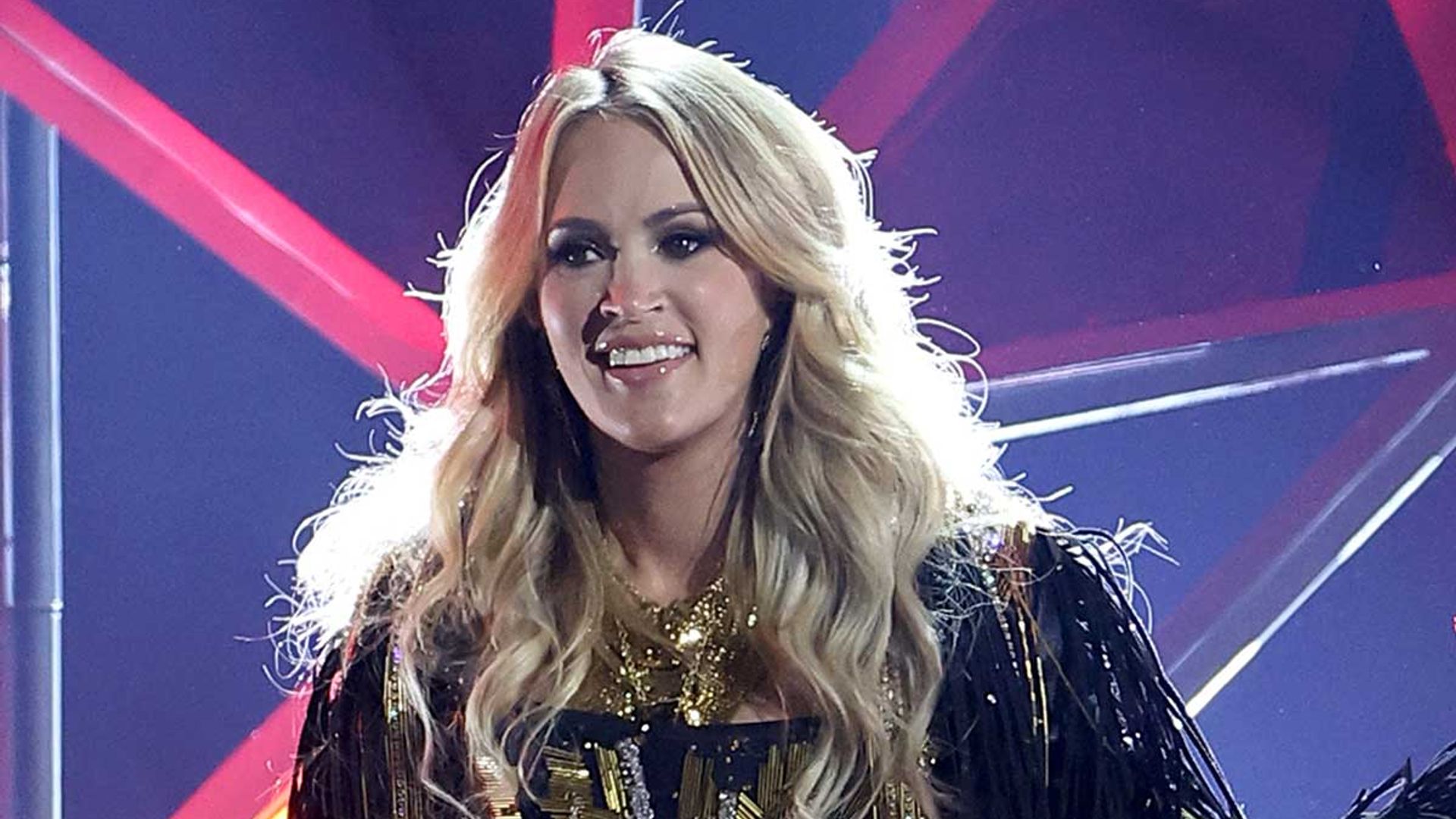 2022 CMAs Carrie Underwood steals the show in the tiniest leather