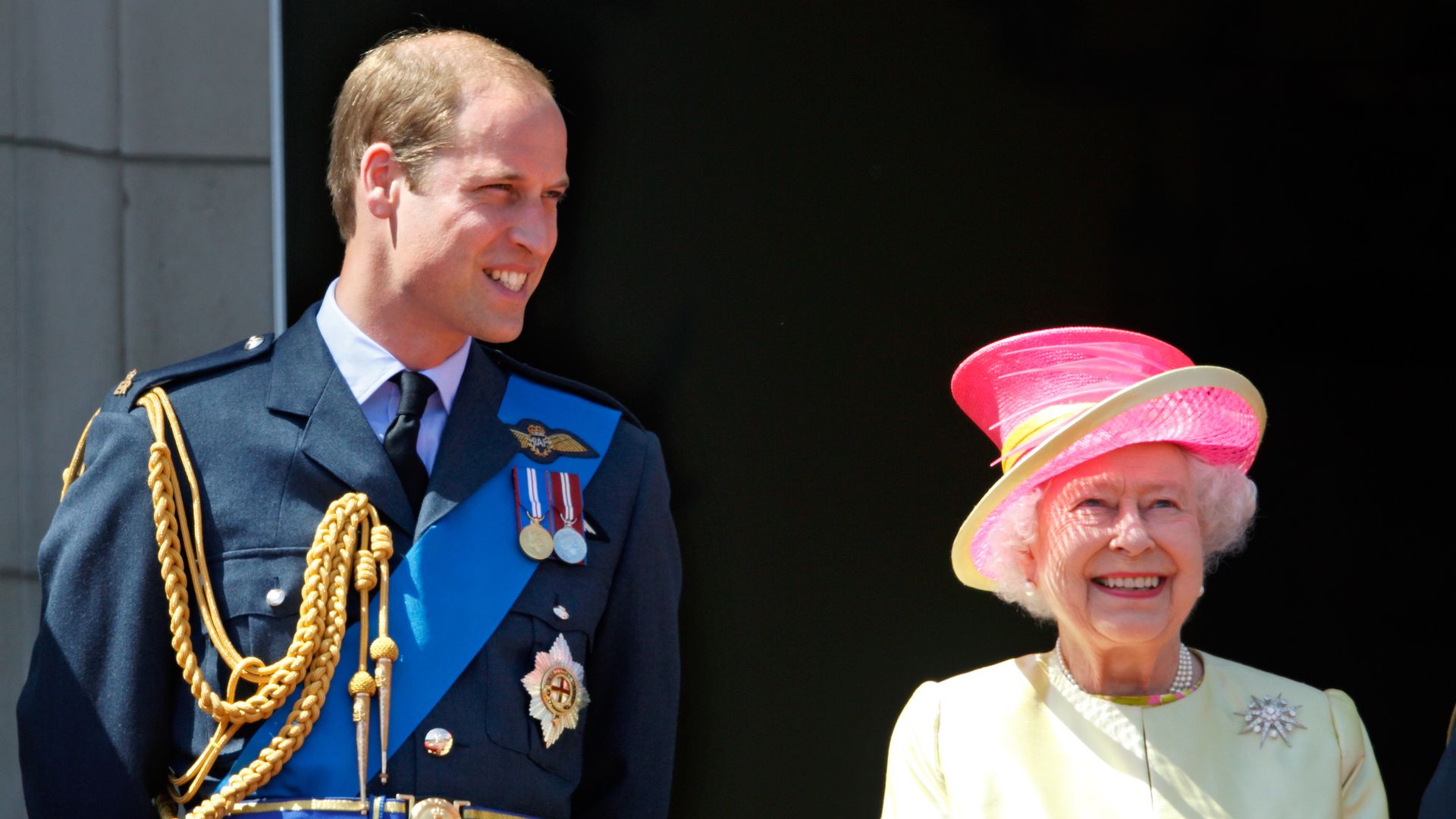  Prince William and Queen Elizabeth smiling from balcony