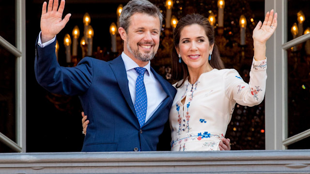 Crown Prince Frederik and Crown Princess Mary wave from balcony