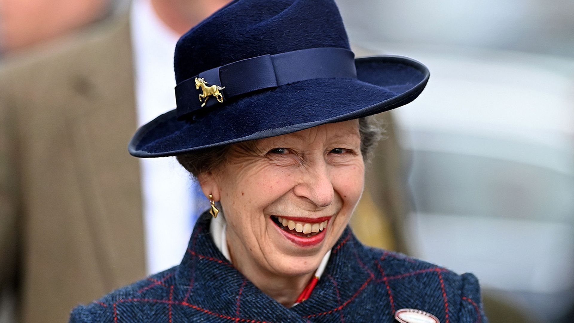 Princess Anne sports knee-high boots with poignant accessory