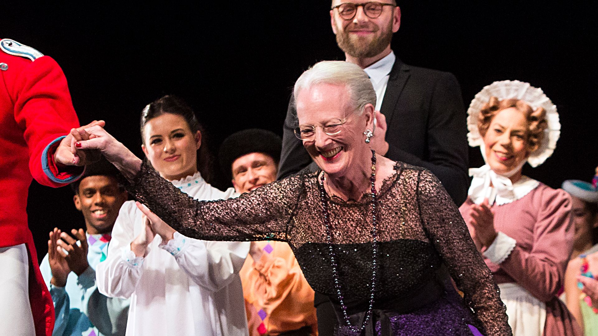Queen Margrethe of Denmark curtsies as she stand with the ballet troupe as they receive the audiences standing ovations at the premiere evening  of the Tarkovsky "The Nutcracker" ballet in 2016