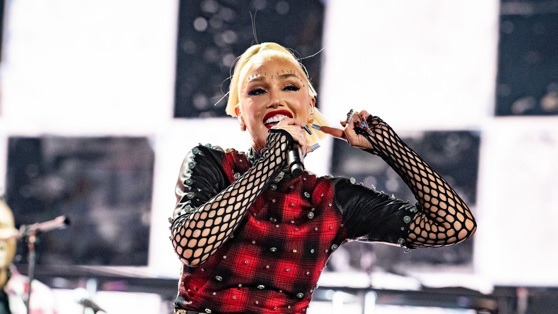 Gwen Stefani commands the crowd in fishnet bodysuit for No Doubt reunion at FireAid concert