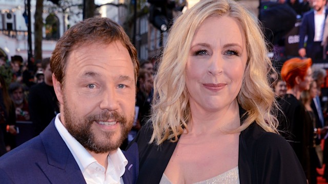 Stephen Graham in a blue suit and Hannah Walters in a sparkly dress