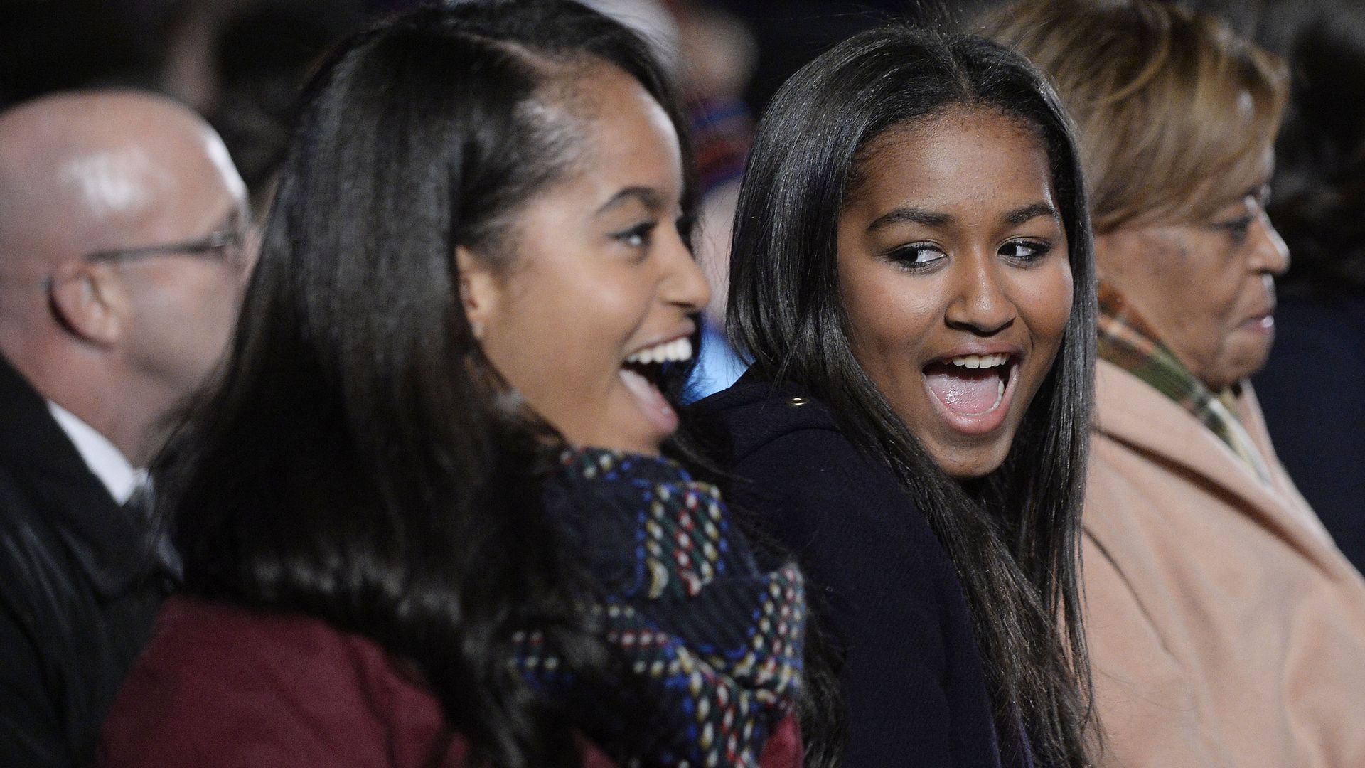 Malia and Sasha Obama are glowing as they enjoy daddy daughter date night with Obama