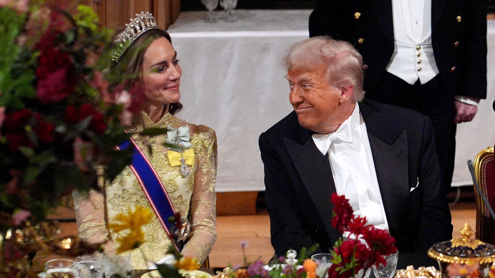US President Donald Trump smiles at Britain's Catherine, Princess of Wales during a State Banquet at Windsor Castle, in Windsor, on September 17, 2025, during the US President's second State Visit. US President Donald Trump arrived in Britain for an unprecedented second State Visit, with the UK government rolling out a royal red carpet welcome to win over the mercurial leader. (Photo by Yui Mok / POOL / AFP) (Photo by YUI MOK/POOL/AFP via Getty Images)          