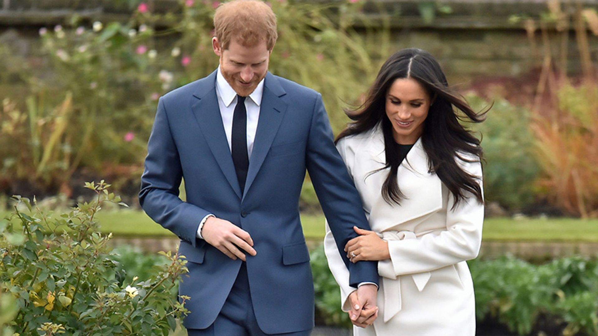 prince harry and meghan markle looking down