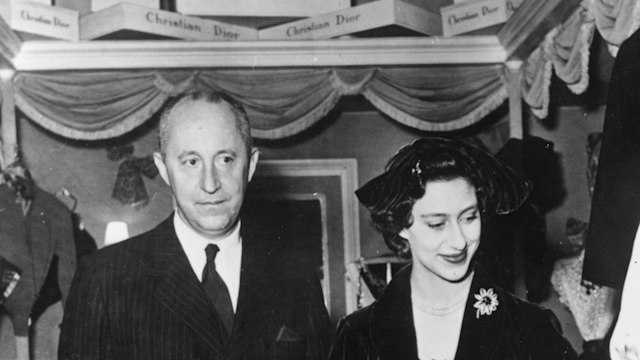 French couturier Christian Dior shows Princess Margaret (1930 - 2002) round his Paris showroom.   (Photo by Mike Lawn/Getty Images)