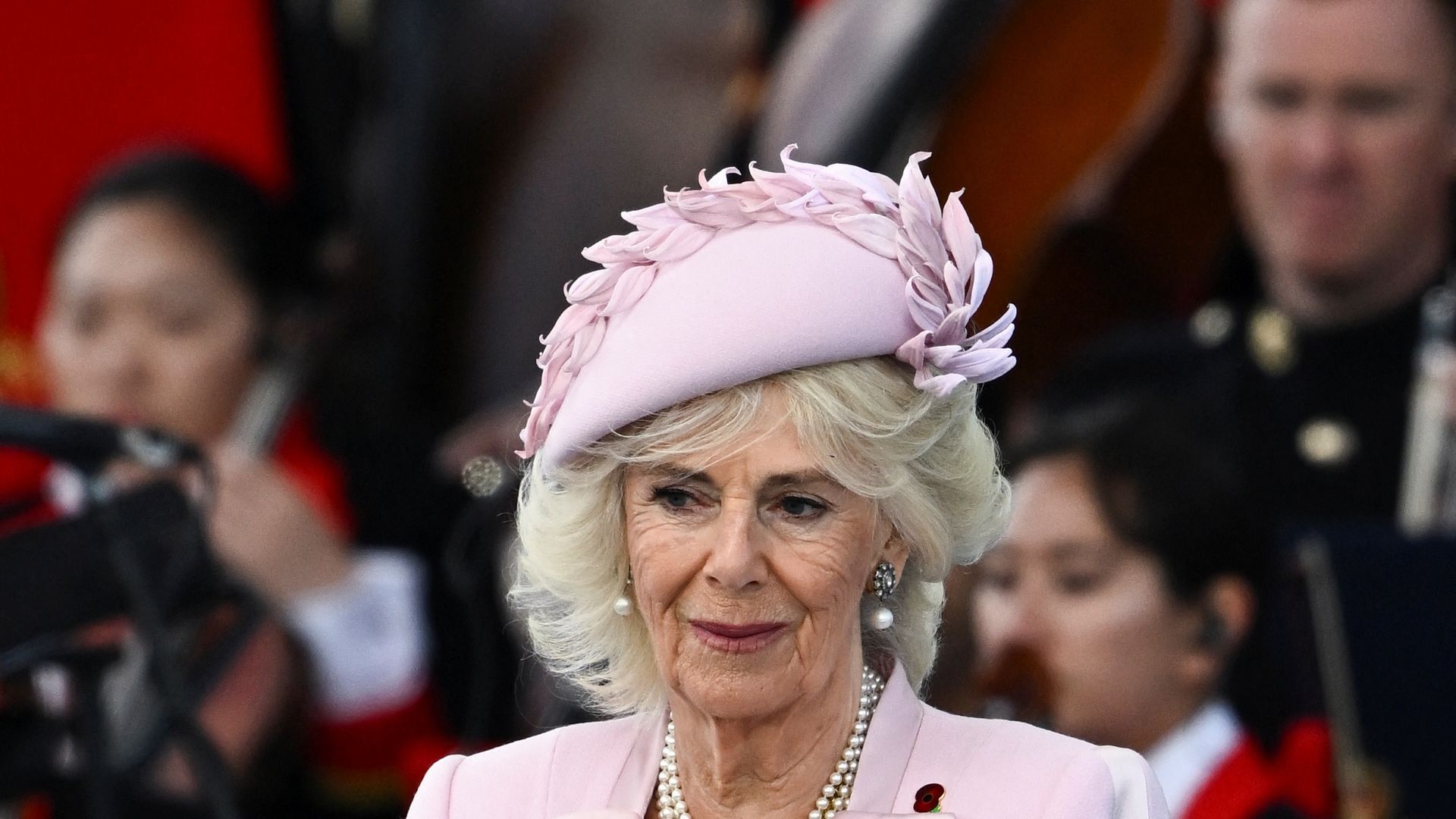 queen camilla in pink outfit 