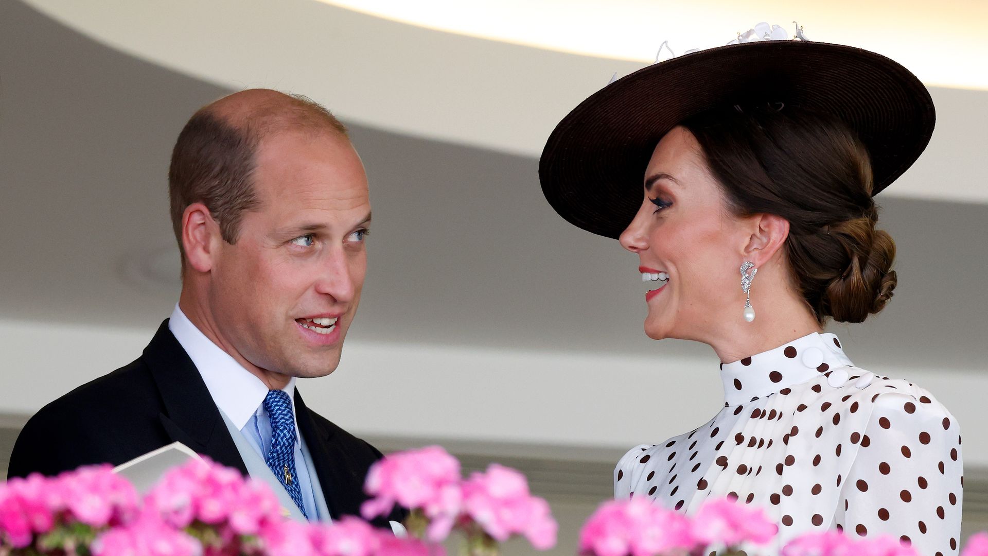 Prince William and Kate exchange a laugh while on balcony at Royal Ascot in 2022