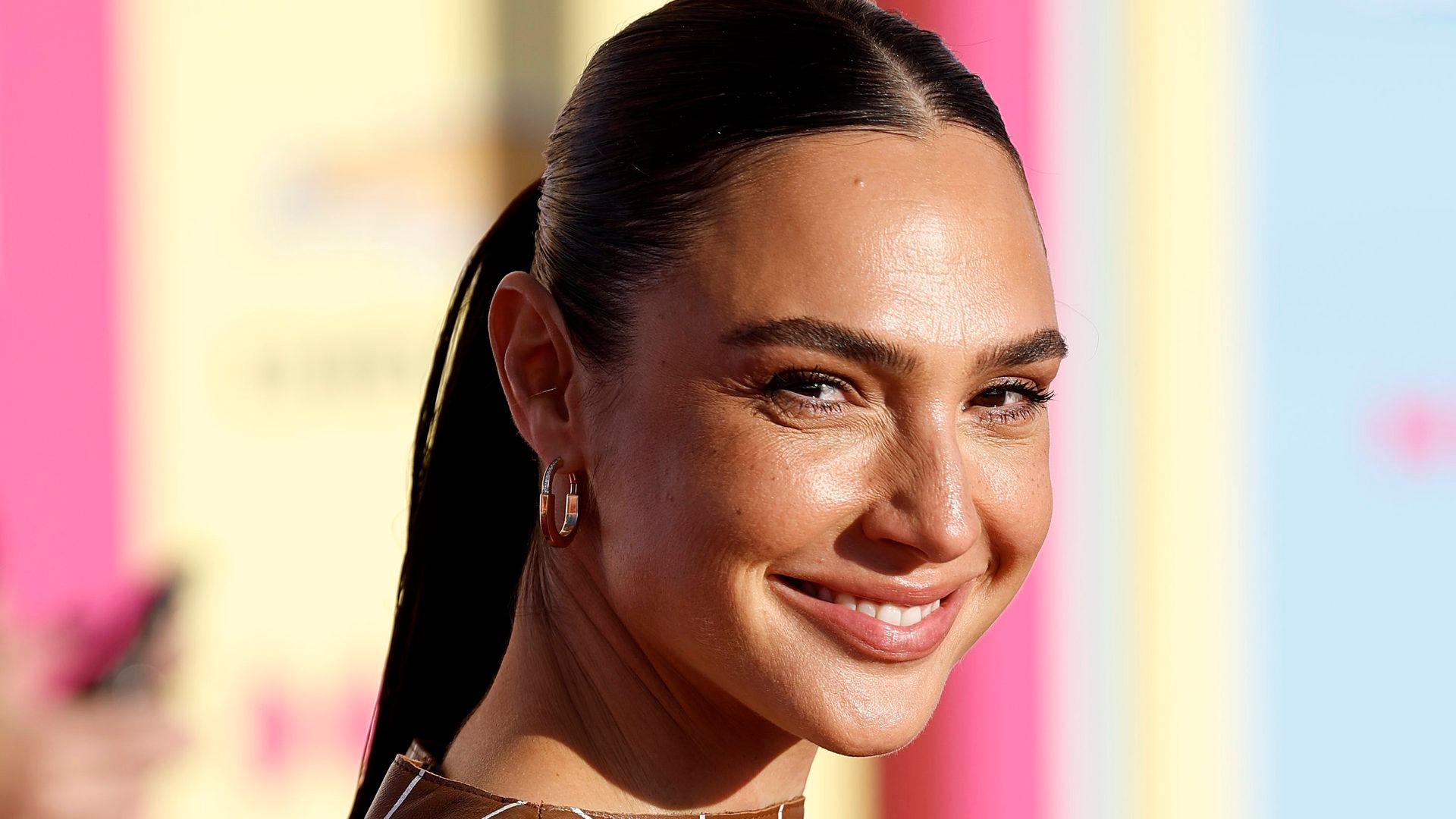 Gal Gadot in a brown mini dress at the world premiere of Barbie in 2023