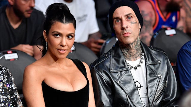 Kourtney Kardashian and Travis Barker are seen in attendance during the UFC 264 event at T-Mobile Arena on July 10, 2021 in Las Vegas