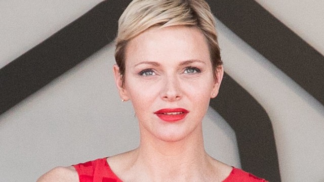 Princess Charlene in red dress with red lip