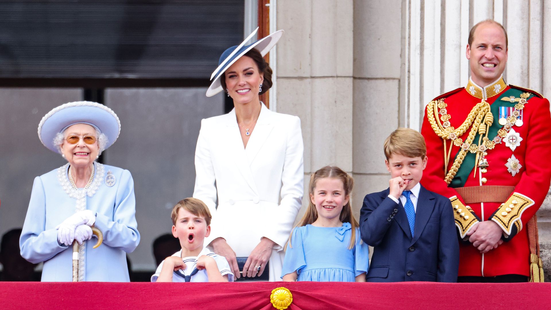 Queen Elizabeth II and the Wales family watch the RAF flypast on the balcony of Buckingham Palace during the Trooping the Colour parade in 2022