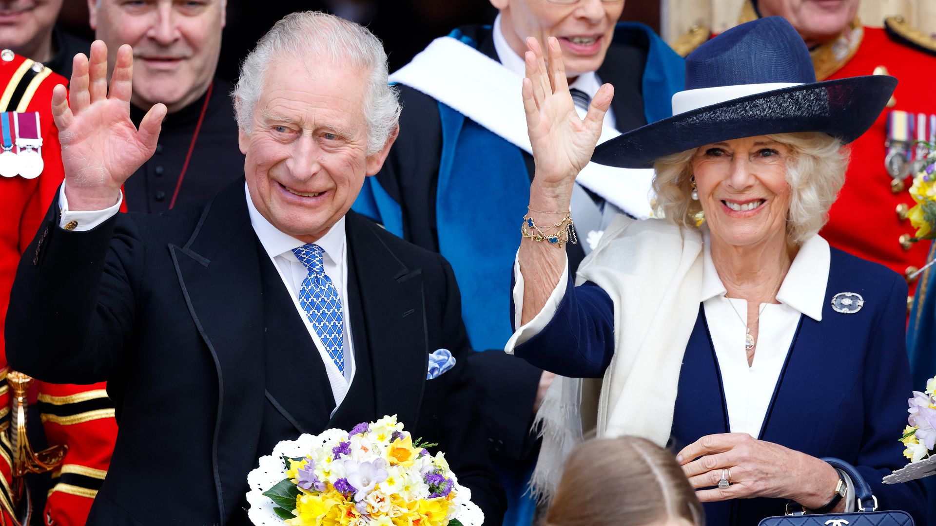 King Charles and Queen Camilla wave after Maundy Thursday service