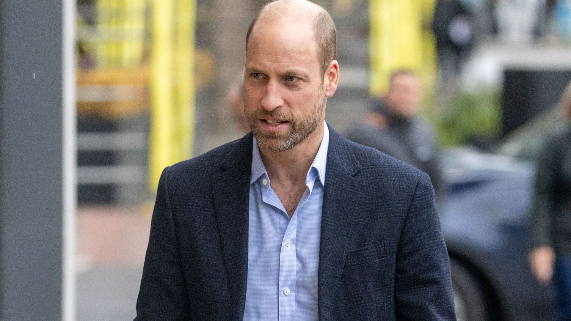 Prince William walking in a suit