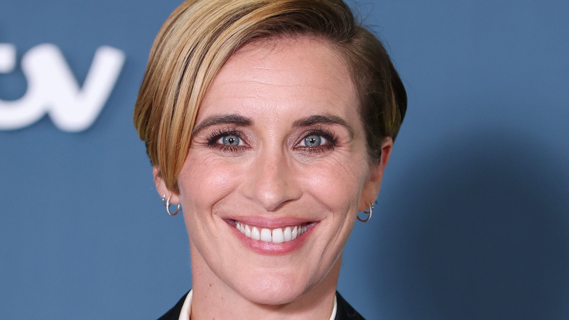 Vicky McClure smiling in white shirt and black blazer
