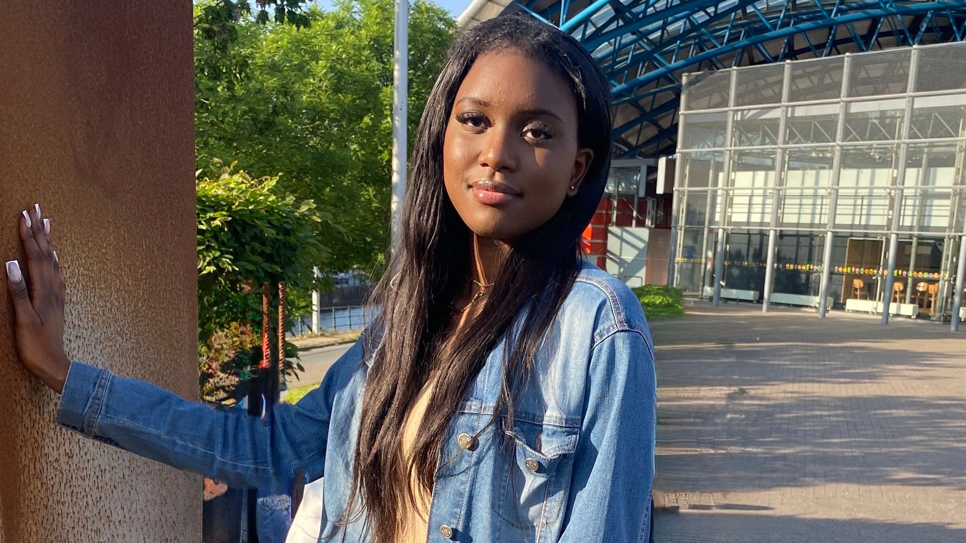 Grace Rockyatou-Sy wearing a denim jacket to promote tall fashion brands