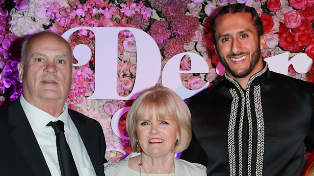 Colin Kaepernick with his parents Rick Kaepernick and Teresa Kaepernick smiling at a red carpet event