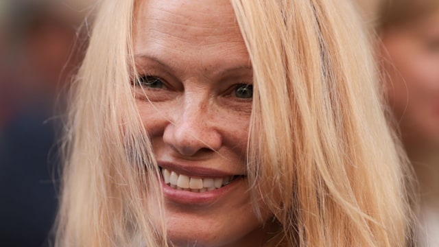 Pamela Anderson is seen outside The Row show wearing a white shirt and black blazer during the Womenswear Spring/Summer 2024 as part of Paris Fashion Week on September 27, 2023 in Paris, France.