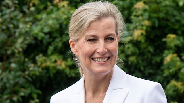 Sophie smiling in white blazer