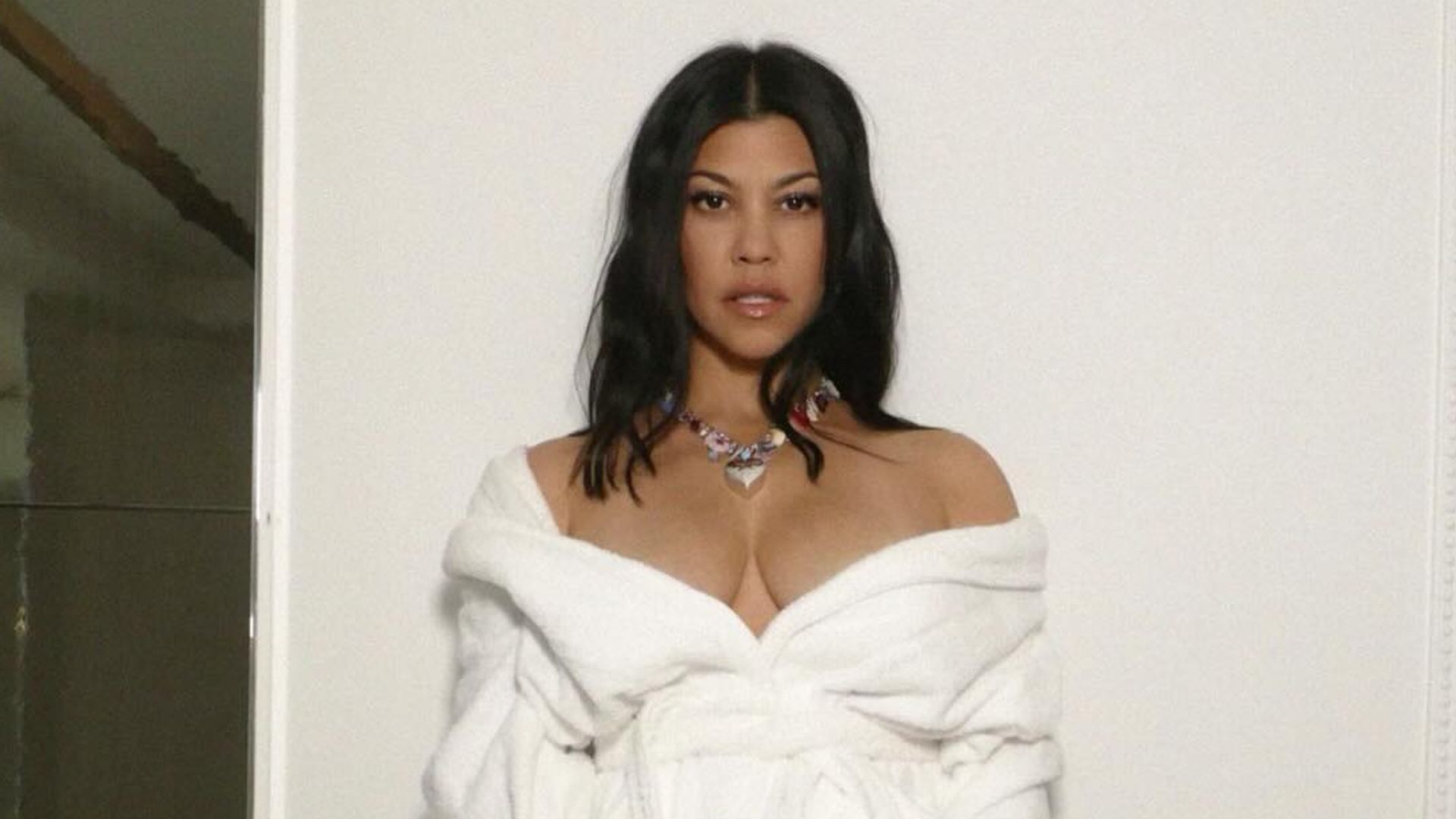 Kourtney Kardashian causes a stir in lingerie and fishnets for exciting announcement