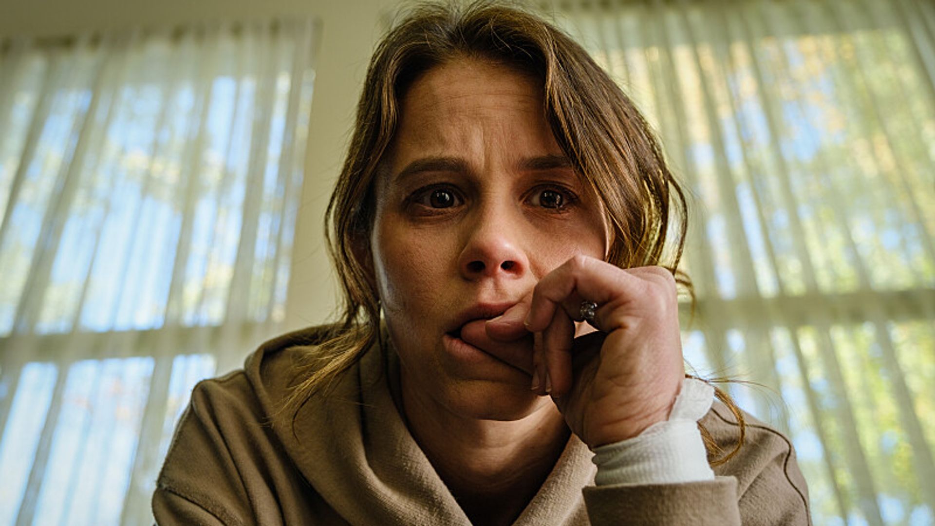 close-up of woman biting nail 