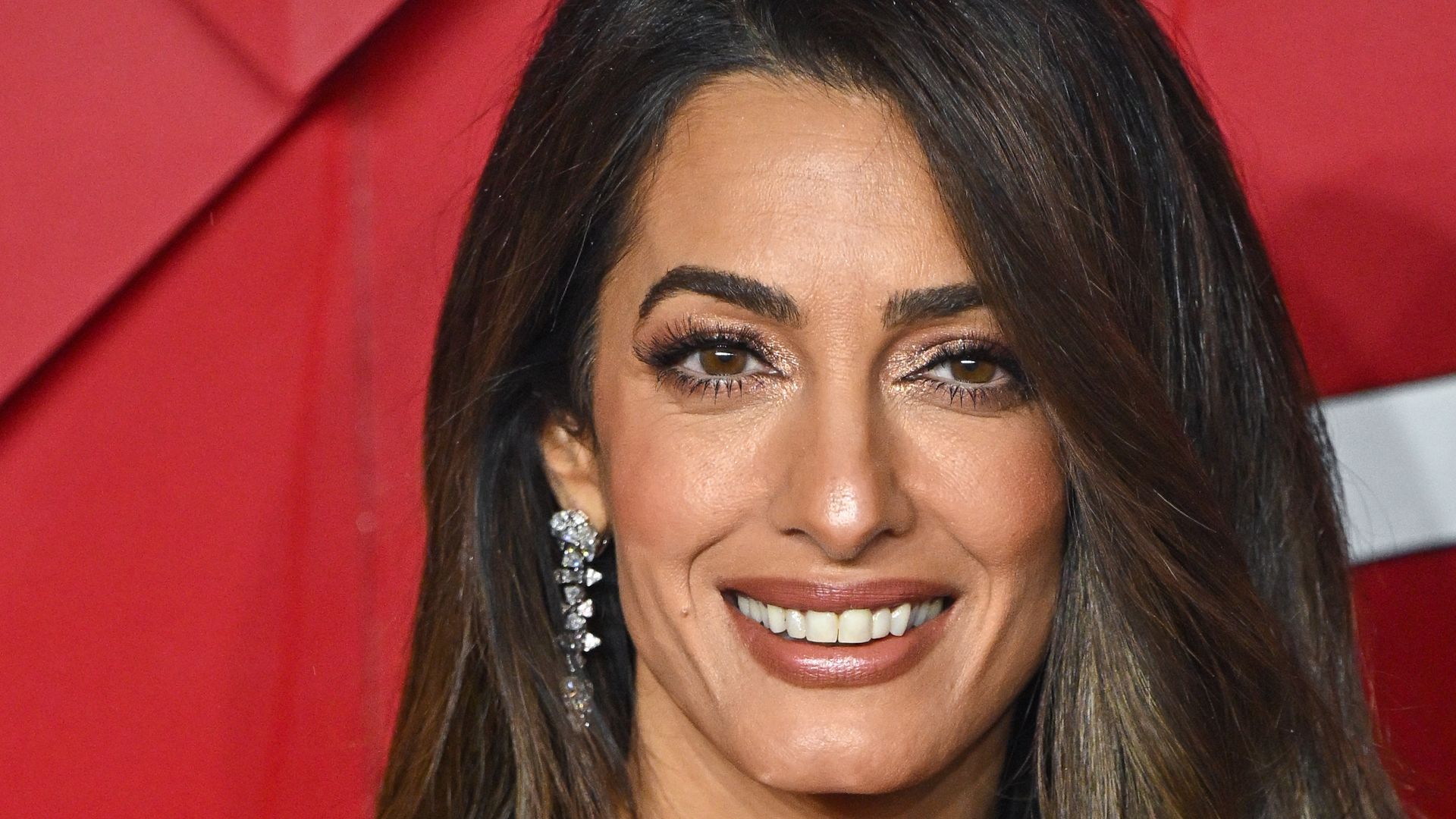 Amal Clooney smiling at the 2023 Fashion Awards 