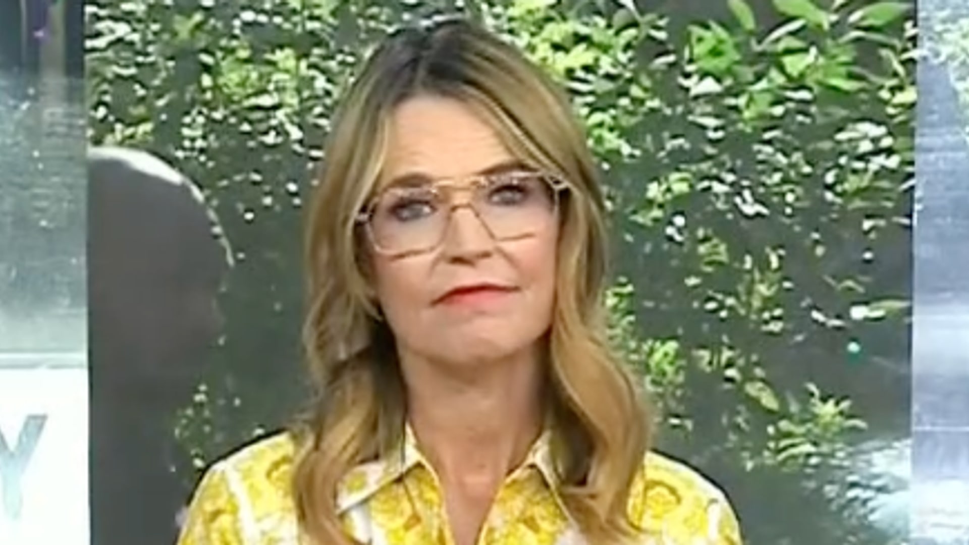 Savannah was wearing new glasses and summer dress