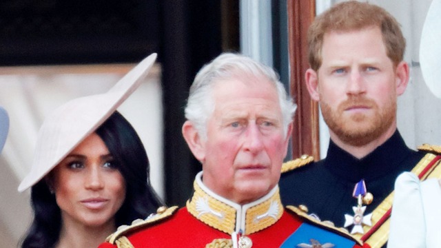 Prince Harry and Meghan Markle with King Charles on balcony