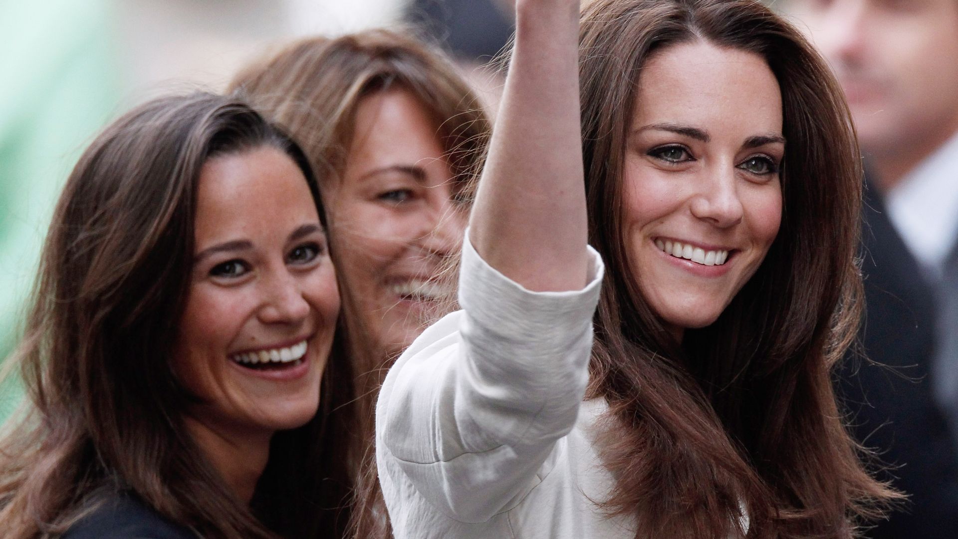 Princess Kate waving with her mother Carole and sister Pippa