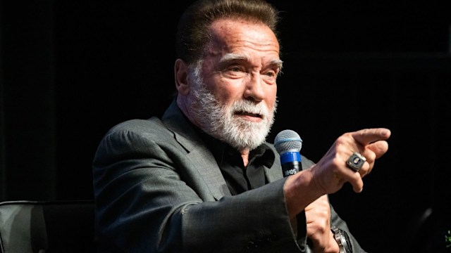 Former Gov. Arnold Schwarzenegger says using the term pollution is more relatable than talking about climate change as he speaks with Willow Bay, dean of USC Annenberg, during a three-day planet summit with the Aspen Institute at the University of Southern California
