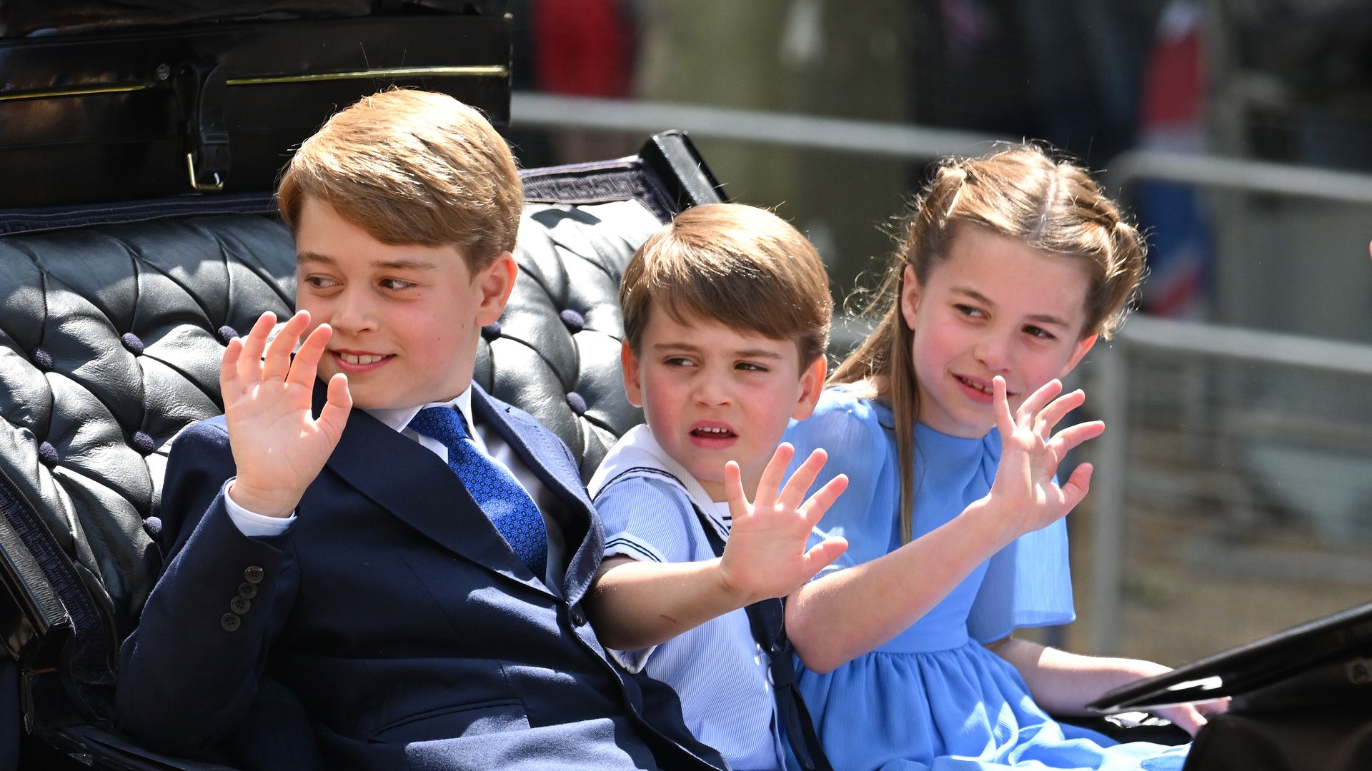 royal kids riding in carriage 