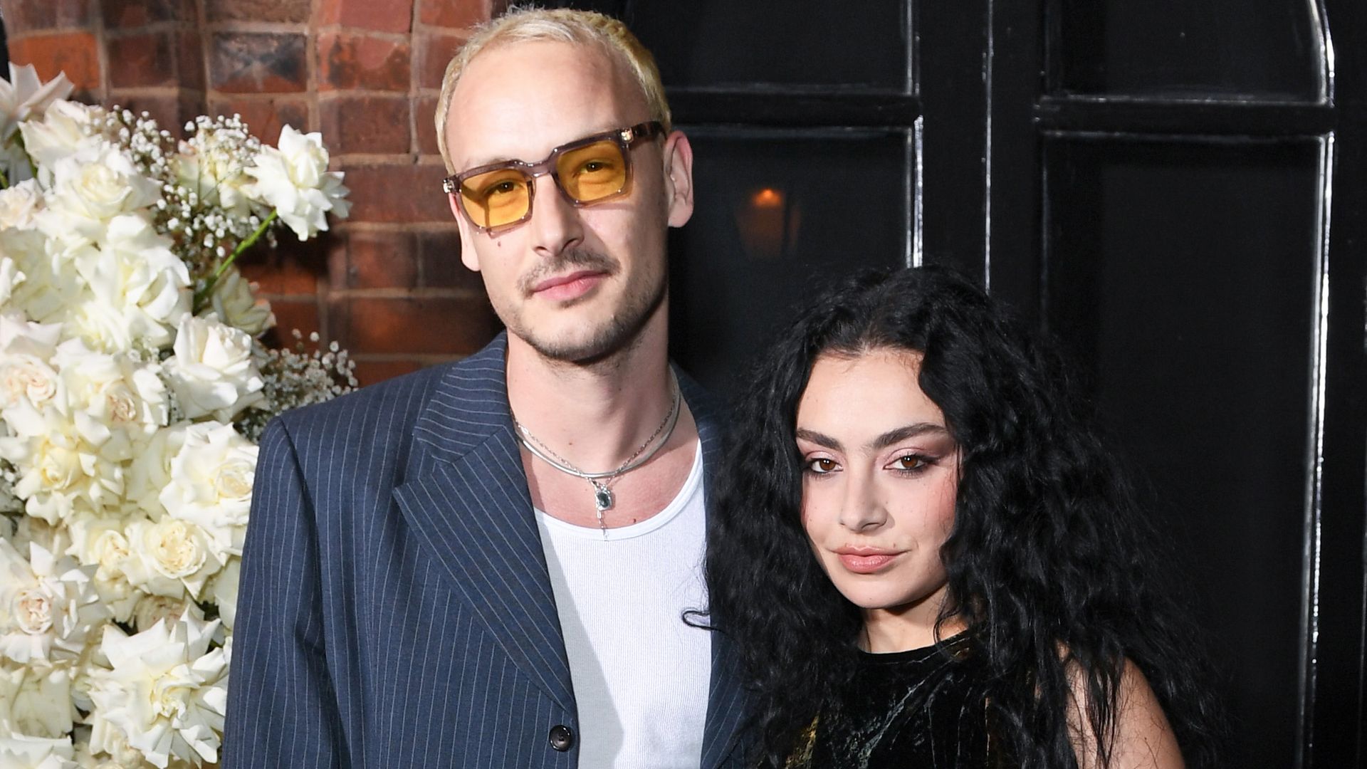 George Daniel (L) and Charli XCX attend the Vogue & Netflix party in celebration of the BAFTA Television Awards at Belvedere Restaurant on May 11, 2023