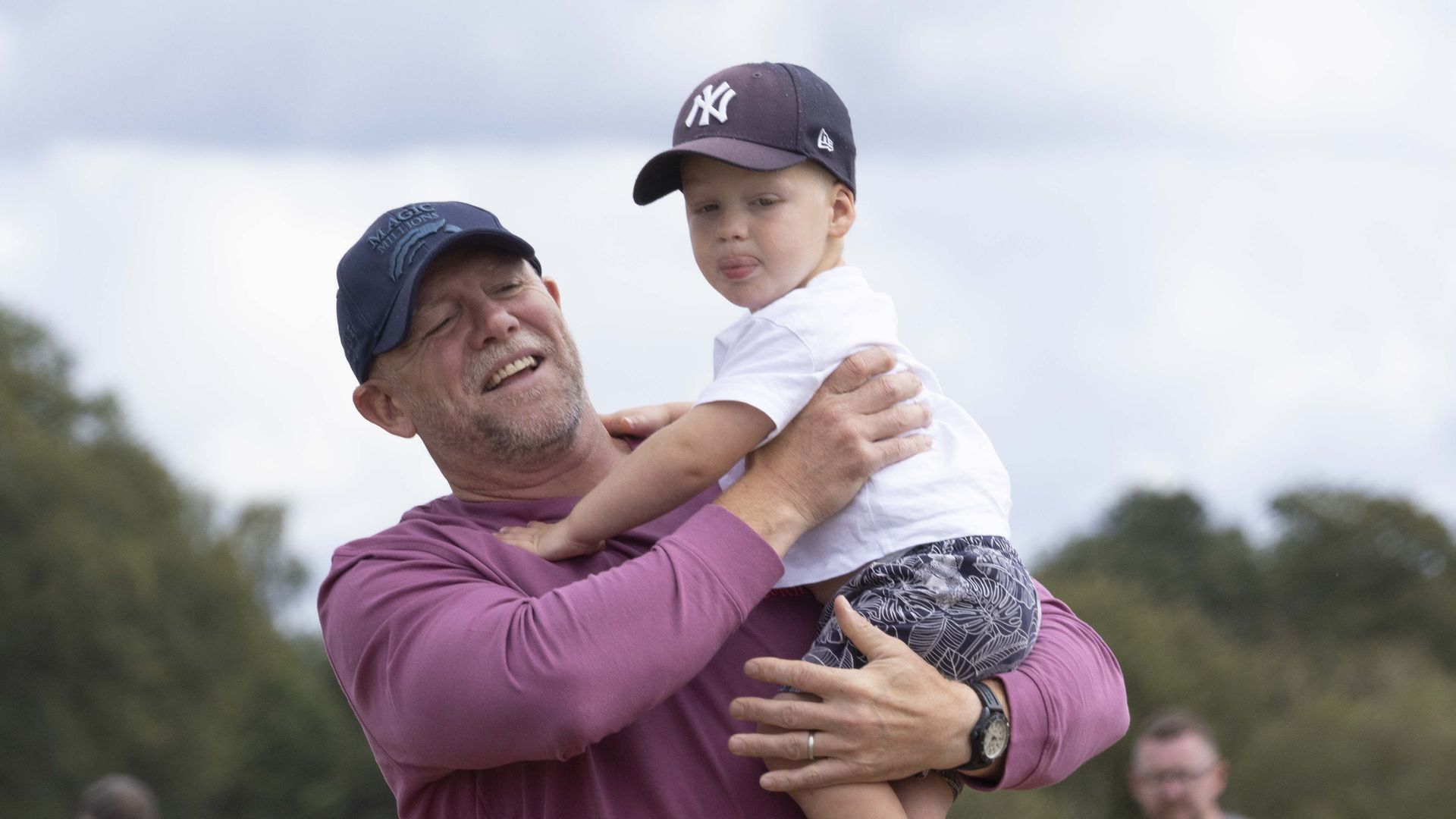 Mike Tindall carries son Lucas at Wellington International Horse Trials