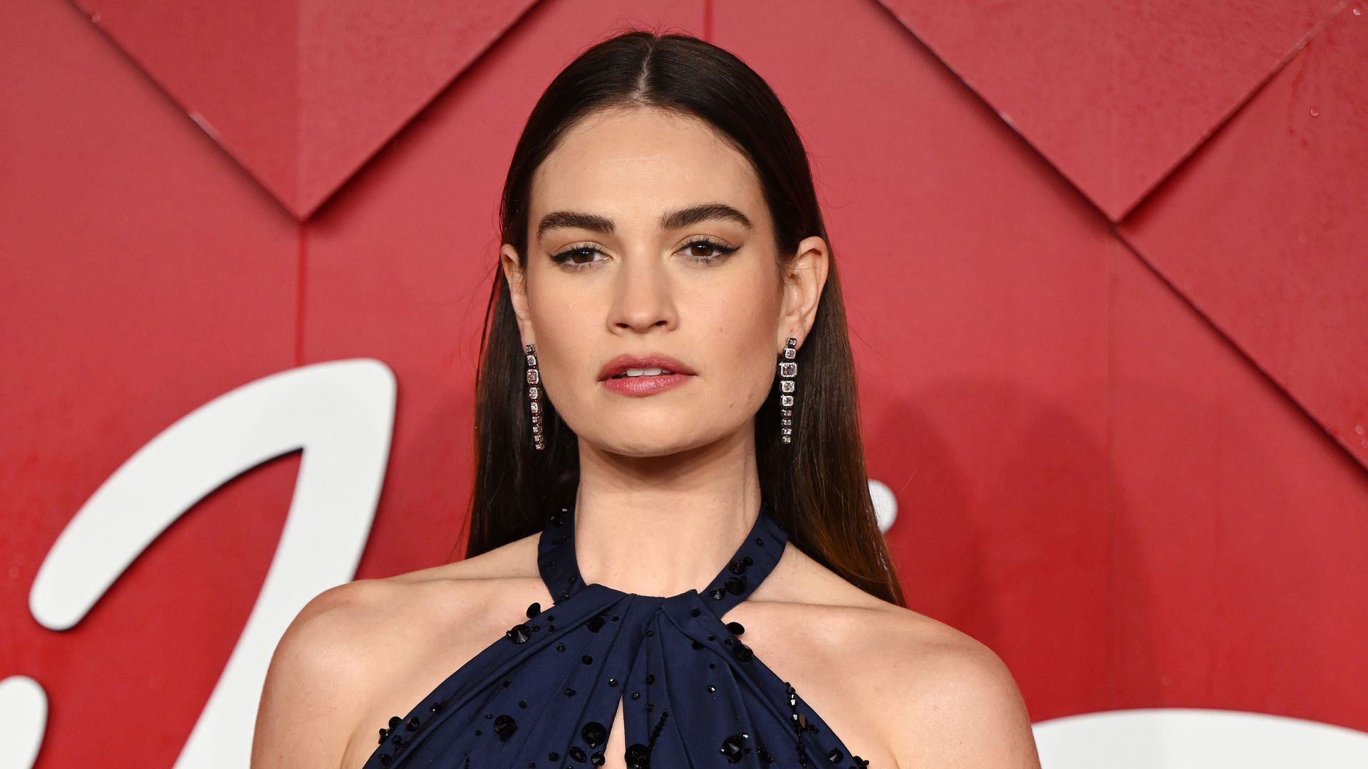LONDON, ENGLAND - DECEMBER 04: Lily James attends The Fashion Awards 2023 Presented by Pandora at the Royal Albert Hall on December 04, 2023 in London, England. (Photo by Karwai Tang/WireImage)