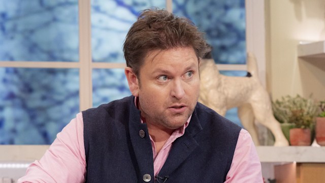 James Martin cooking food in a pink shirt and waistcoat