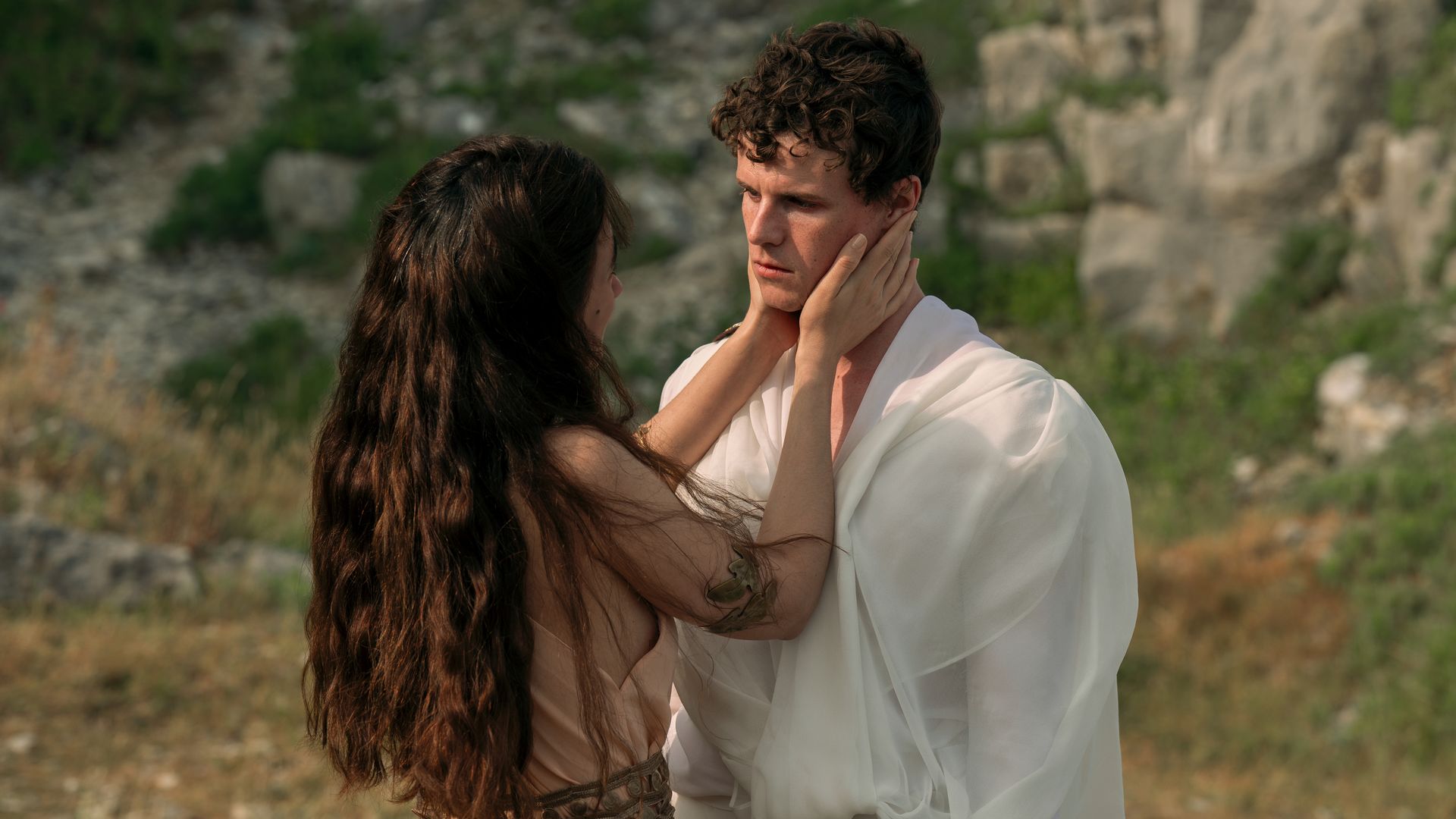 woman holding mans face 