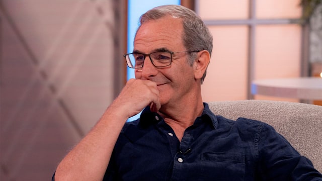 Robson Green wearing a navy shirt while appearing on Lorraine. 