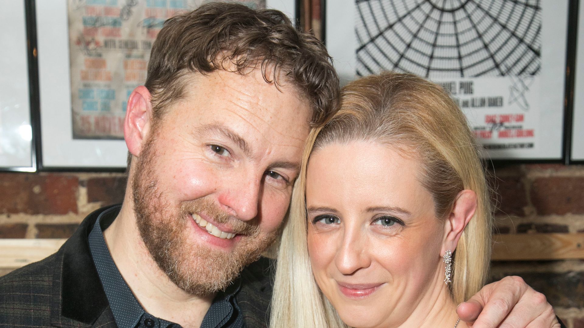 man and woman smiling for photo